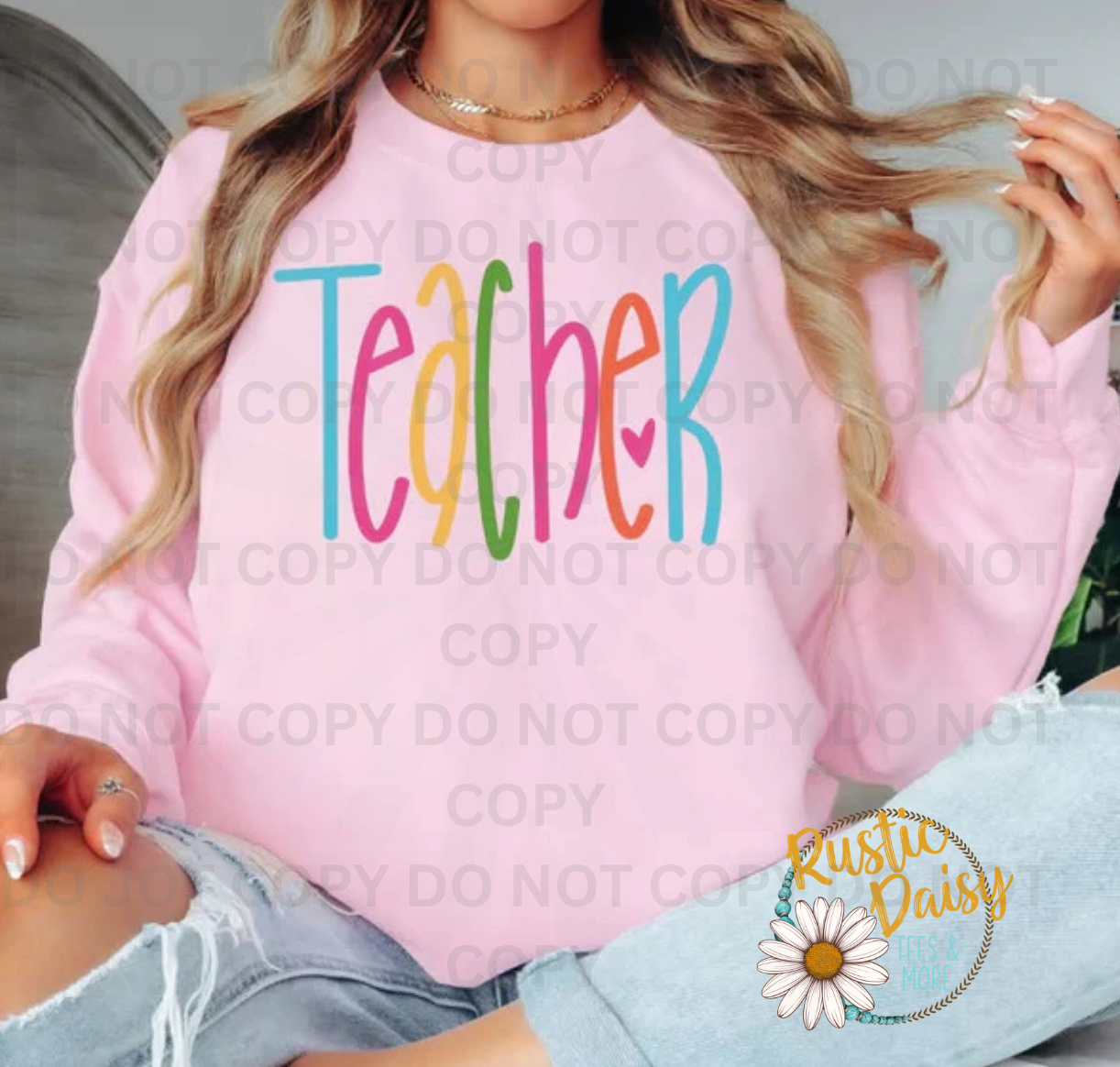 "Teacher" in multicolor bold lettering with a small heart accent.