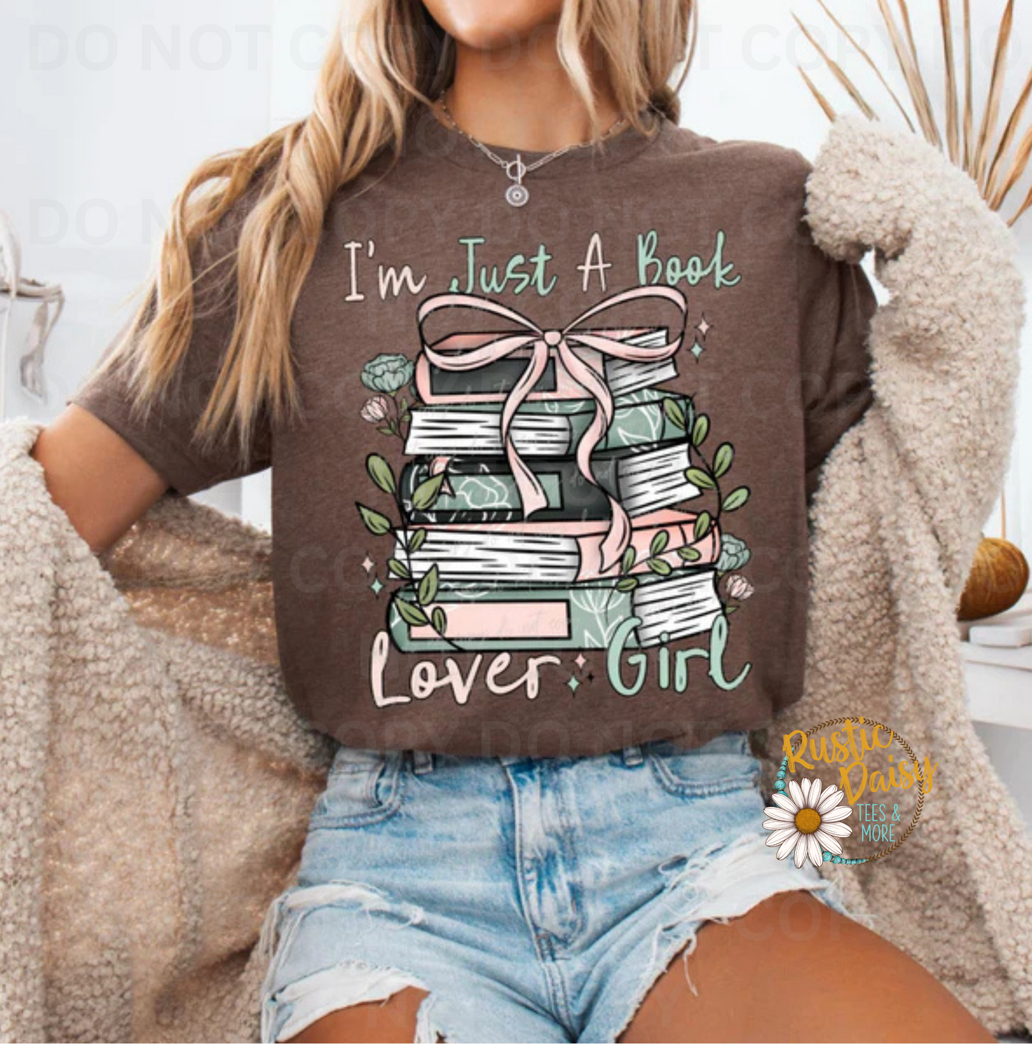 T-shirt with I'm Just A Book Lover Girl text and stack of books with pink ribbon and floral accents