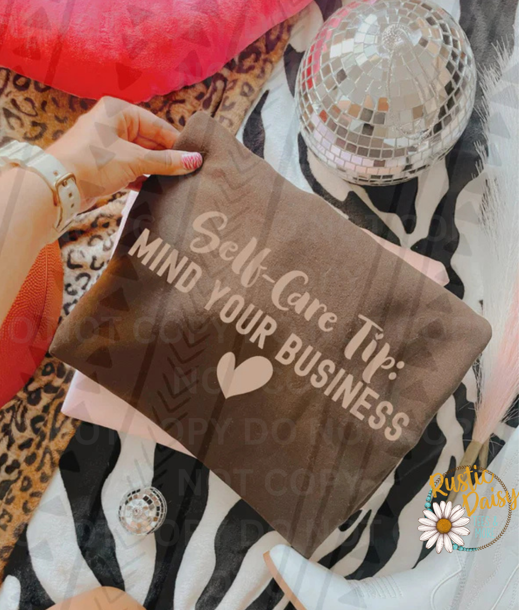 T-shirt with Self-Care Tip: MIND YOUR BUSINESS text with heart in tan