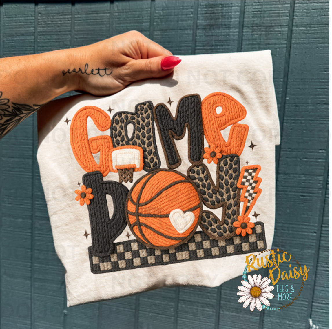 T-shirt with Game Day text in orange and black faux yarn, basketball with heart, leopard print, checkered pattern, and flowers