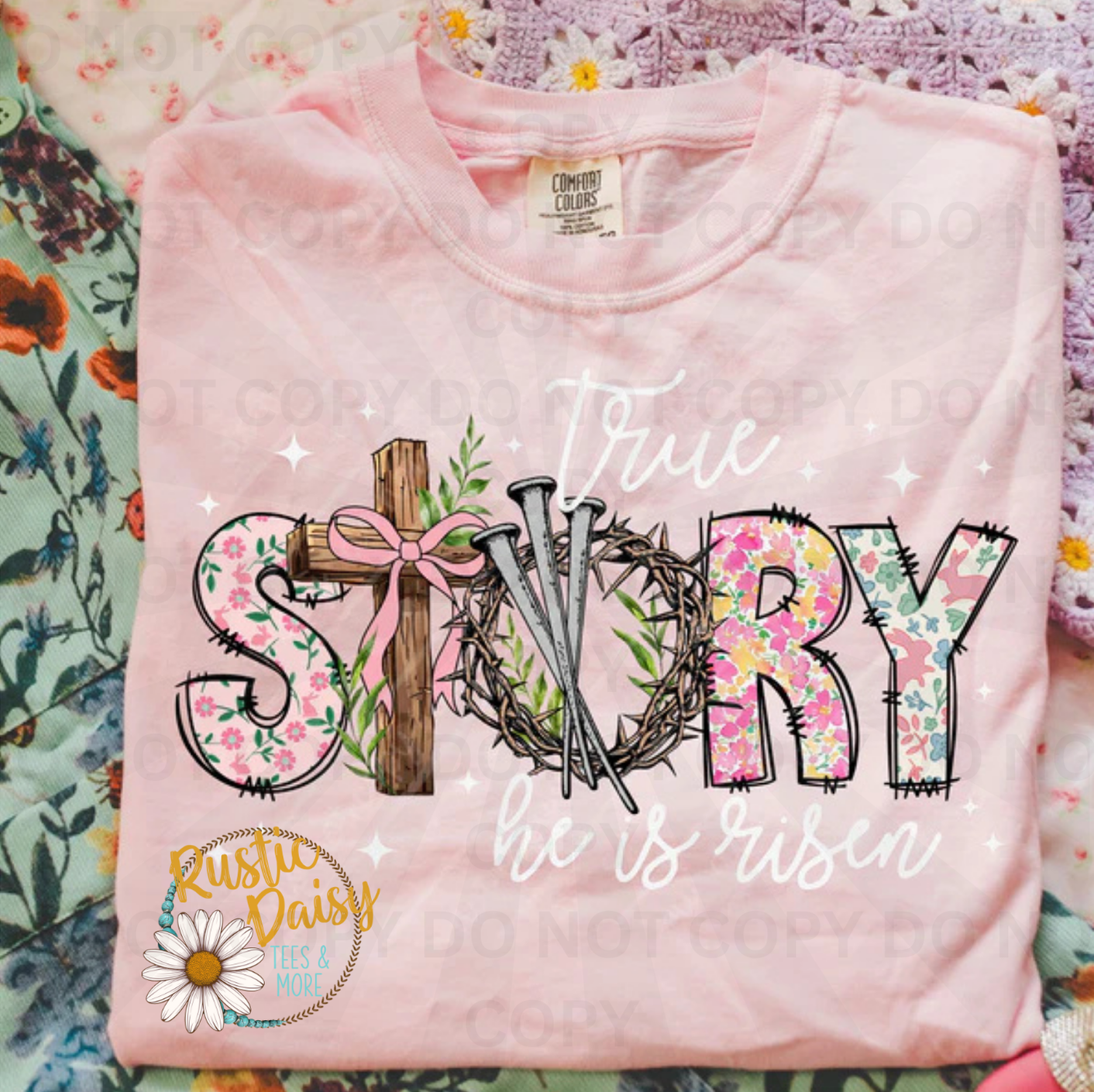 True story he is risen in white & floral text with wooden cross, crown of thorns, pink bow, floral pattern, and stars