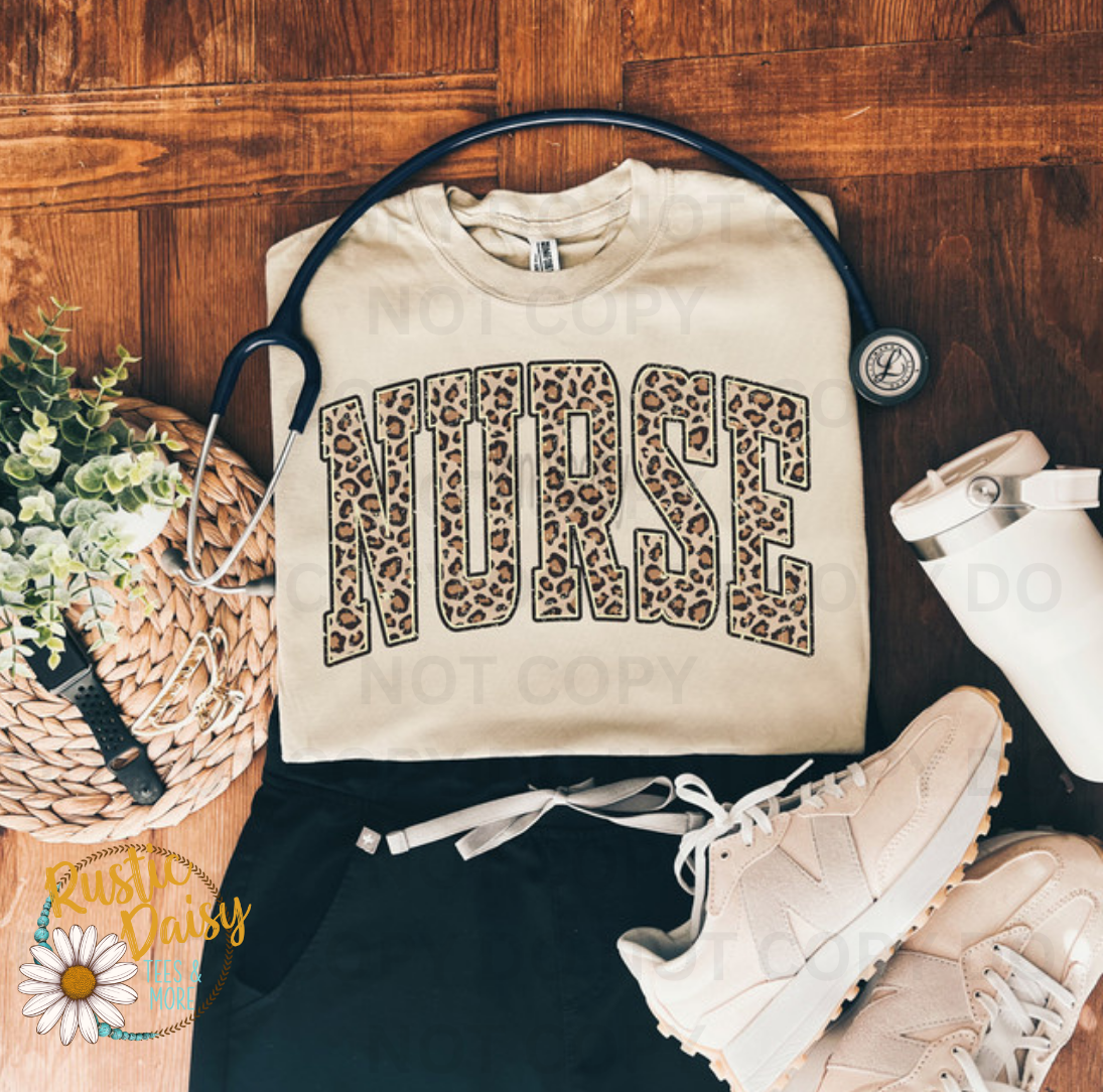 T-shirt with NURSE text in bold block letters filled with leopard print pattern