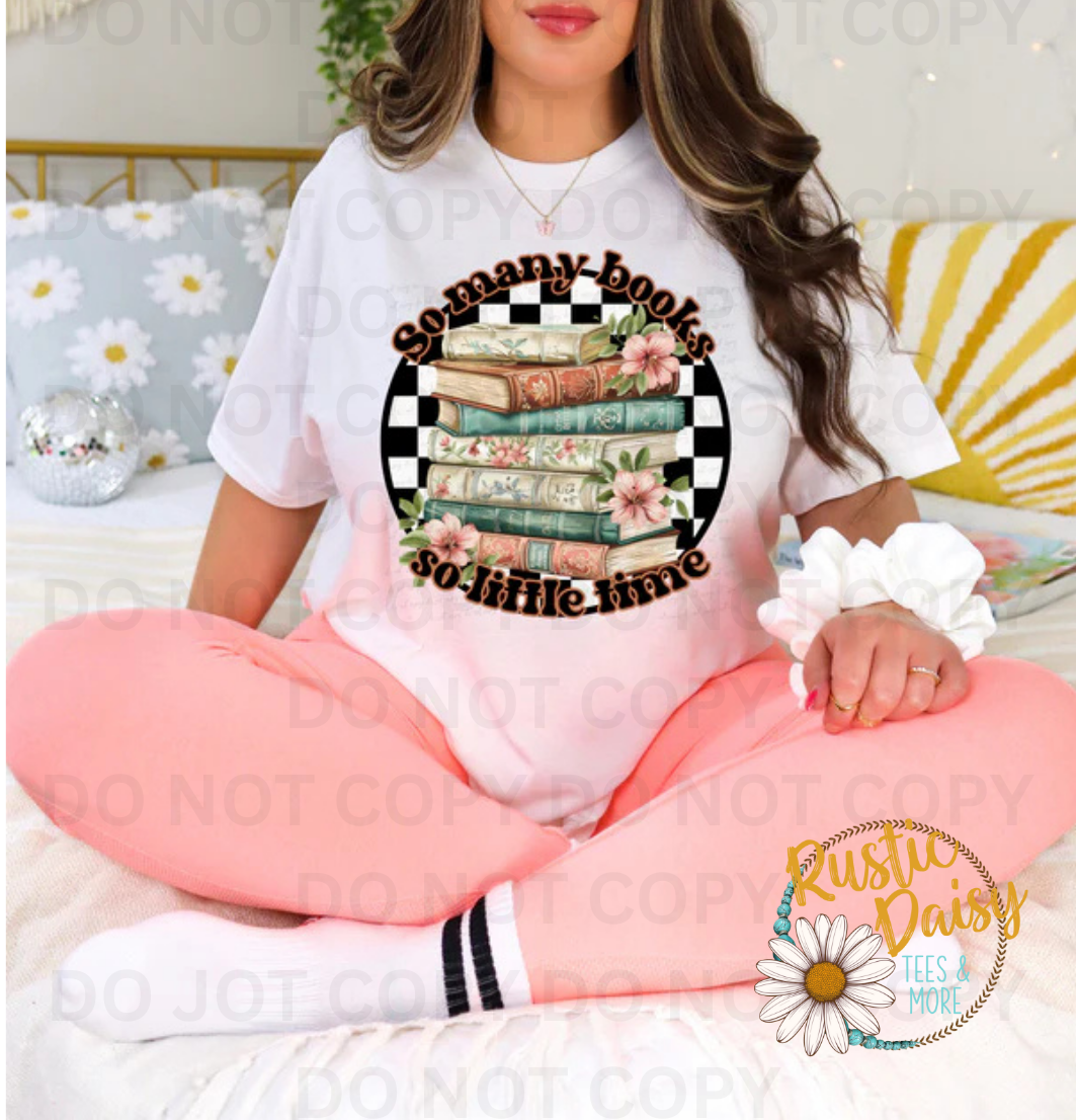 T-shirt with so many books so little time text with stack of books in turquoise and pink with flowers and checkered border