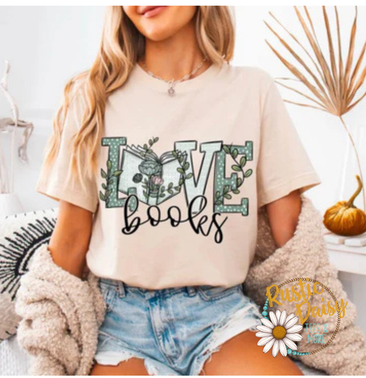 T-shirt with LOVE text filled with floral pattern in different shades of green and the word books in black script lettering