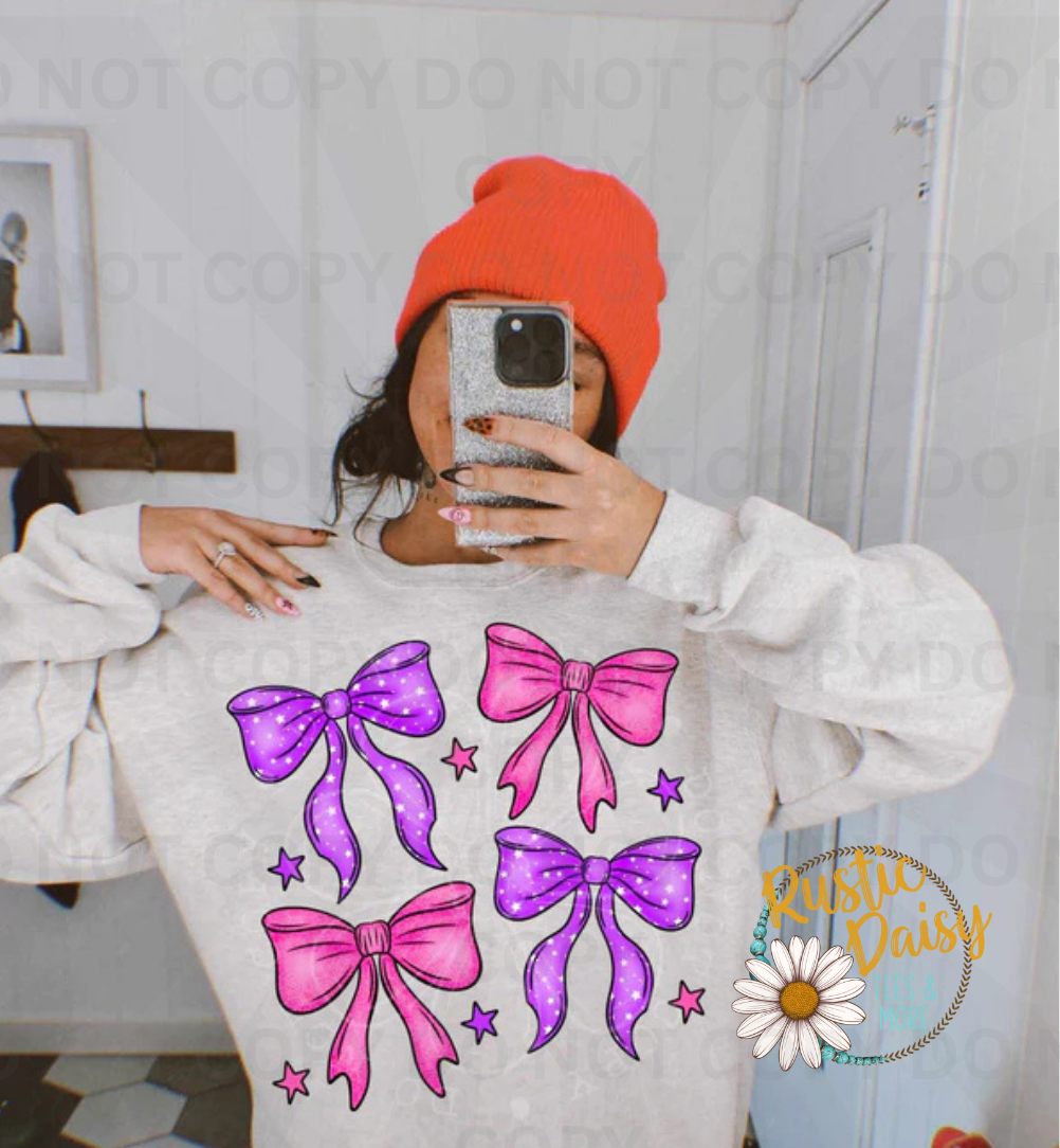 Pink and purple ribbon bows in decorative pattern