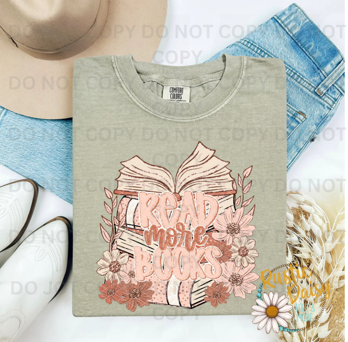 Stacked open books with Read More Books script and pink floral accents