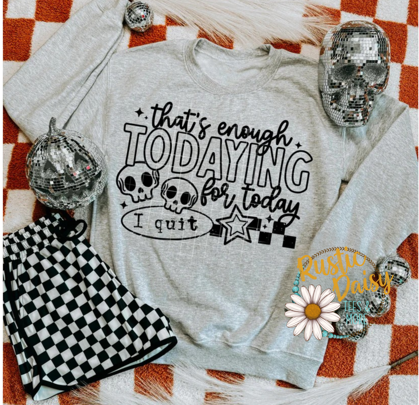 T-shirt with that's enough todaying for today I quit text, skulls, stars, and checkered accents in black