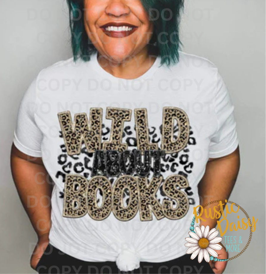T-shirt with WILD ABOUT BOOKS text in tan leopard print letters with black leopard print spots and faux black glitter