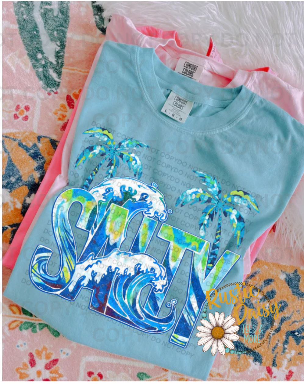 "Salty" in tie-dye lettering with ocean waves and palm trees.