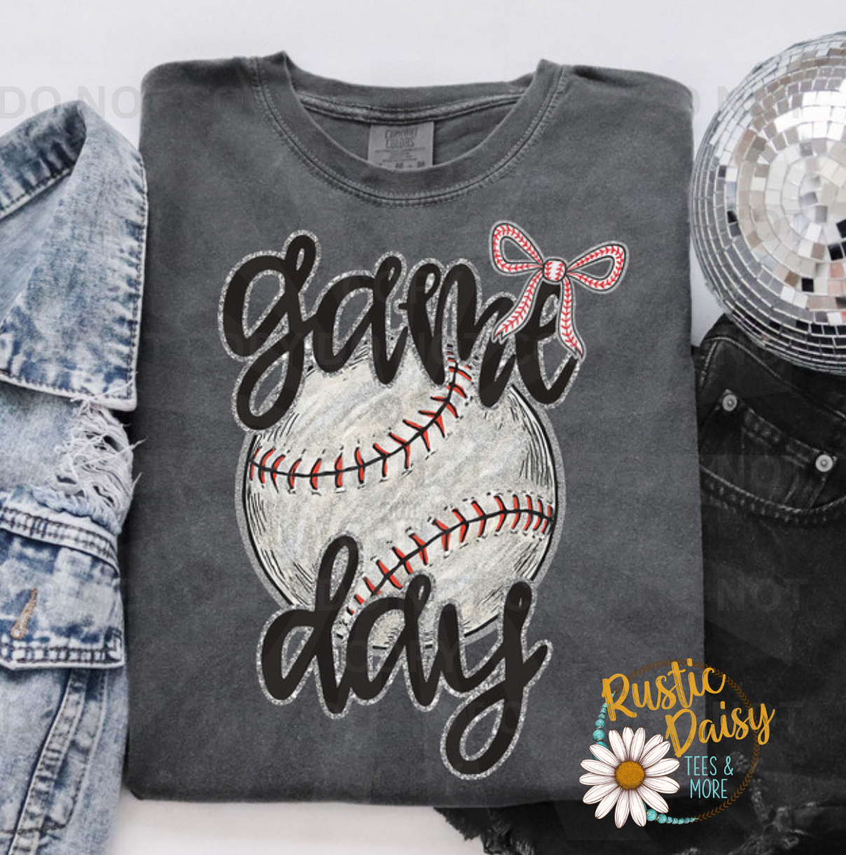 "Game Day" in black script over a distressed baseball with a faux glitter bow.