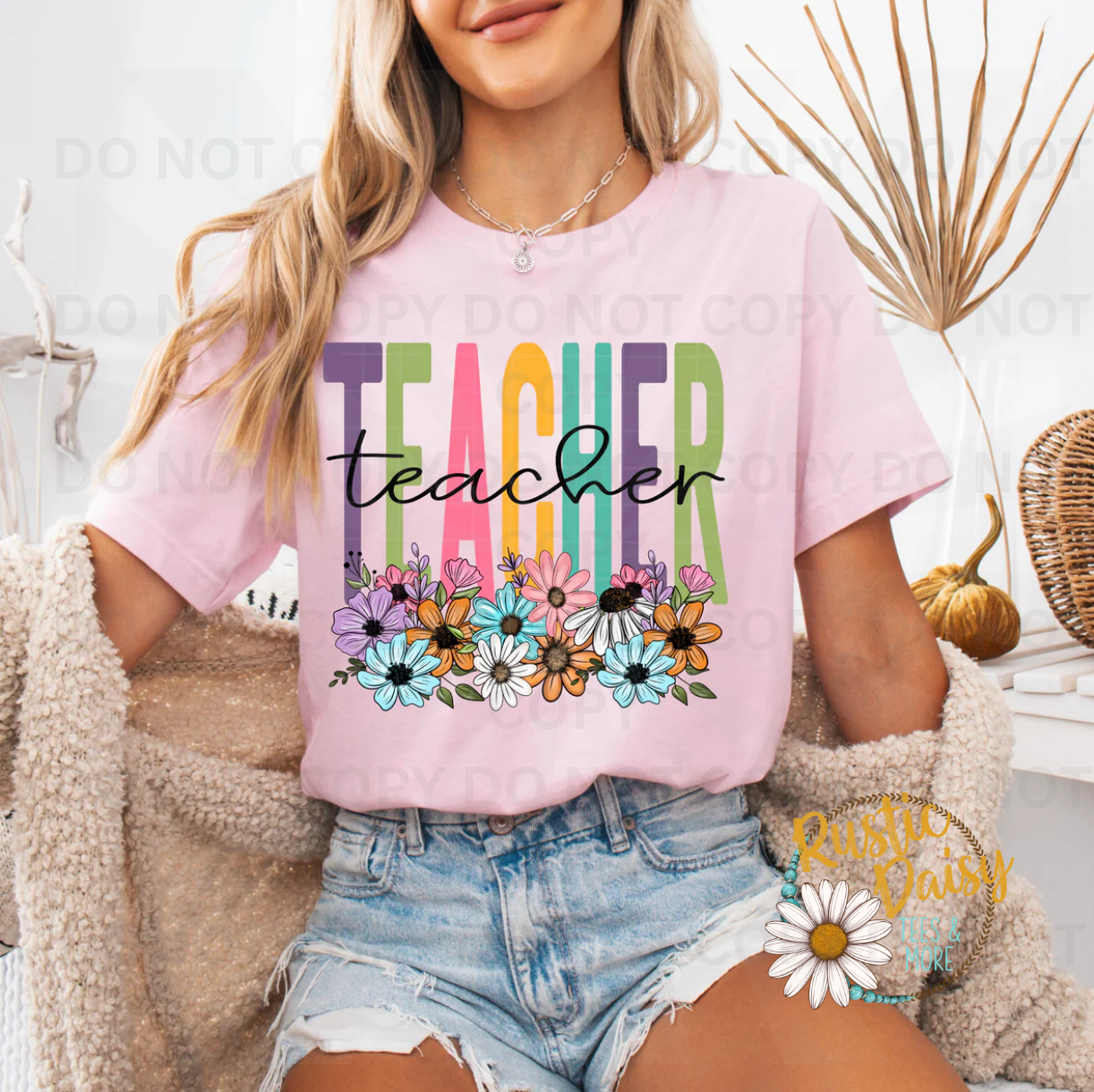 "Teacher" in multicolor block letters with black script overlay and wildflowers.