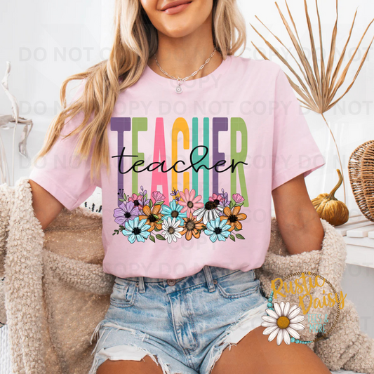 "Teacher" in multicolor block letters with black script overlay and wildflowers.