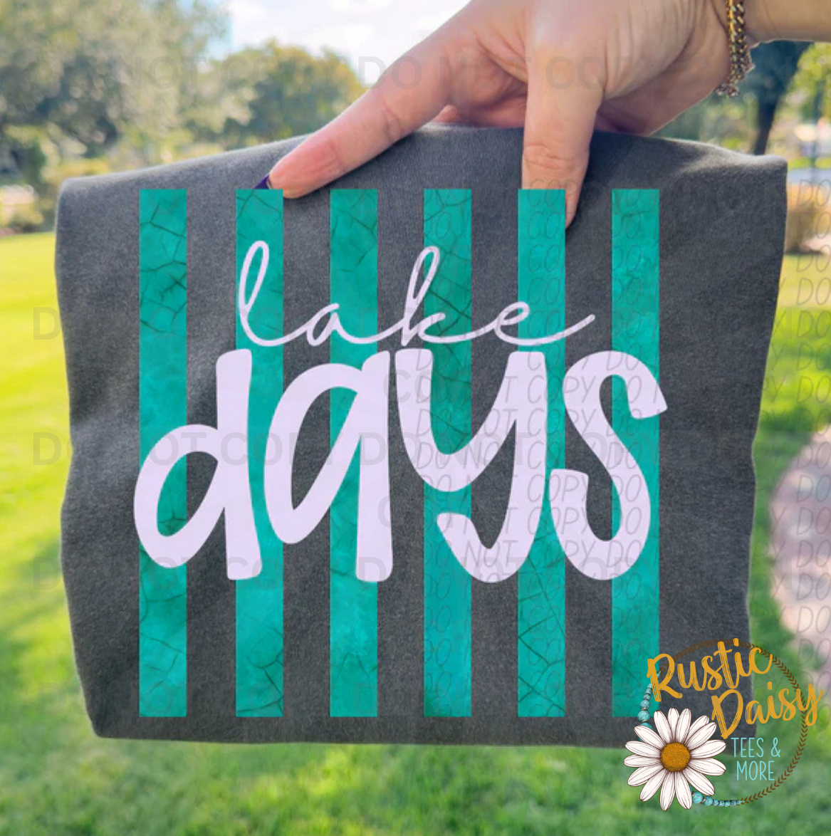 "Lake Days" in white script over teal vertical stripes.
