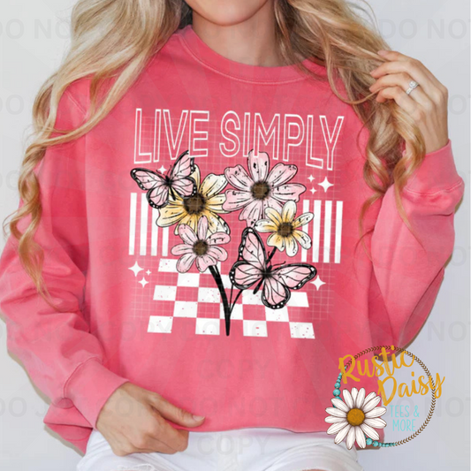 Live simply text with daisies and butterflies design