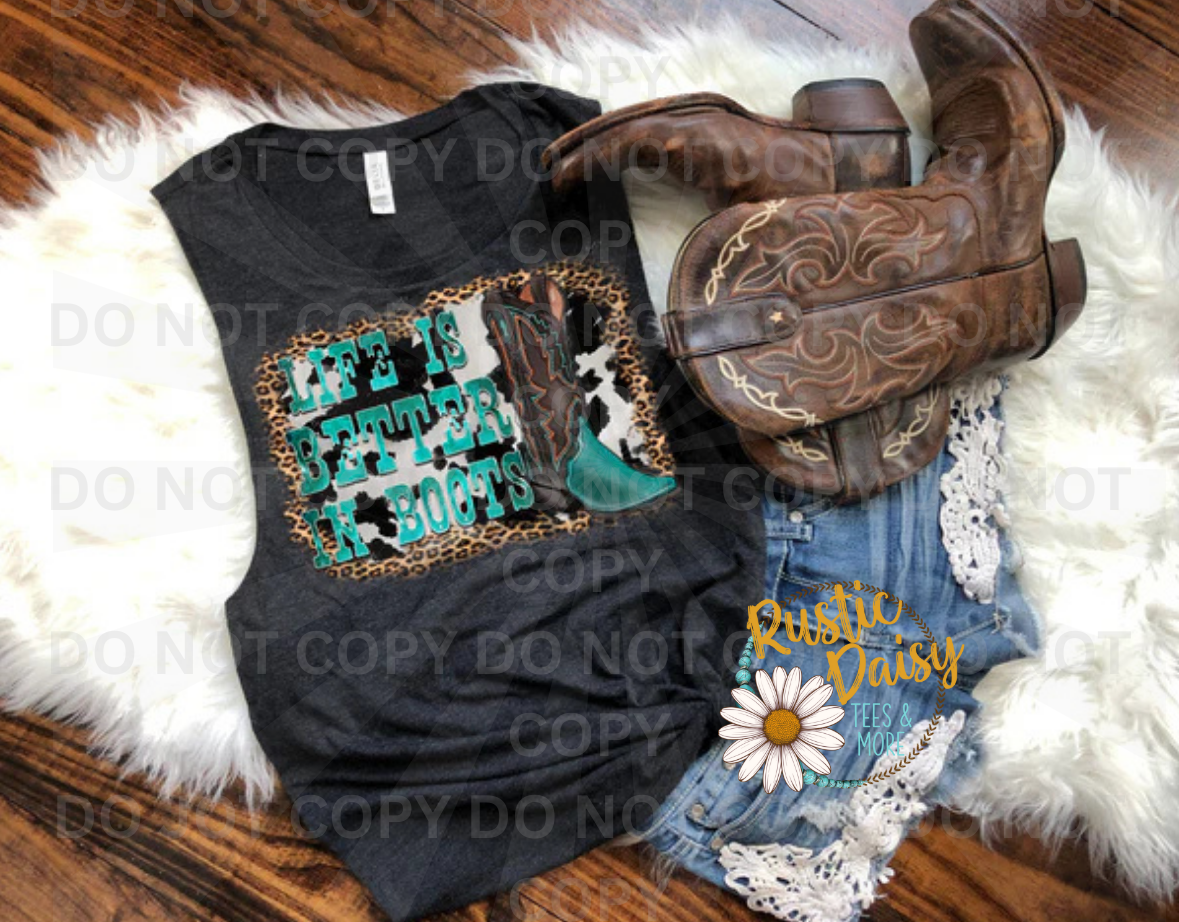 Life Is Better In Boots text in turquoise with cowhide and leopard print patterns on black background