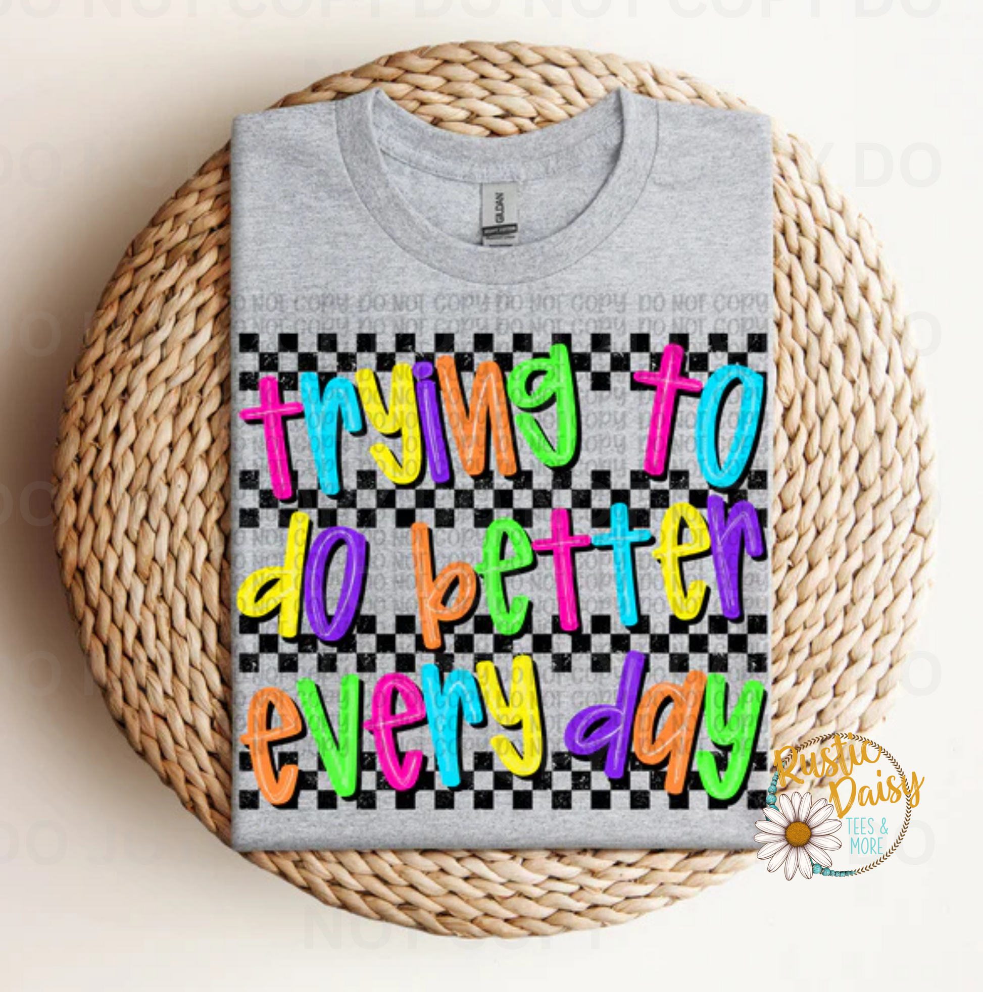 T-shirt with trying to do better everyday text in colorful letters on black and white checkered background