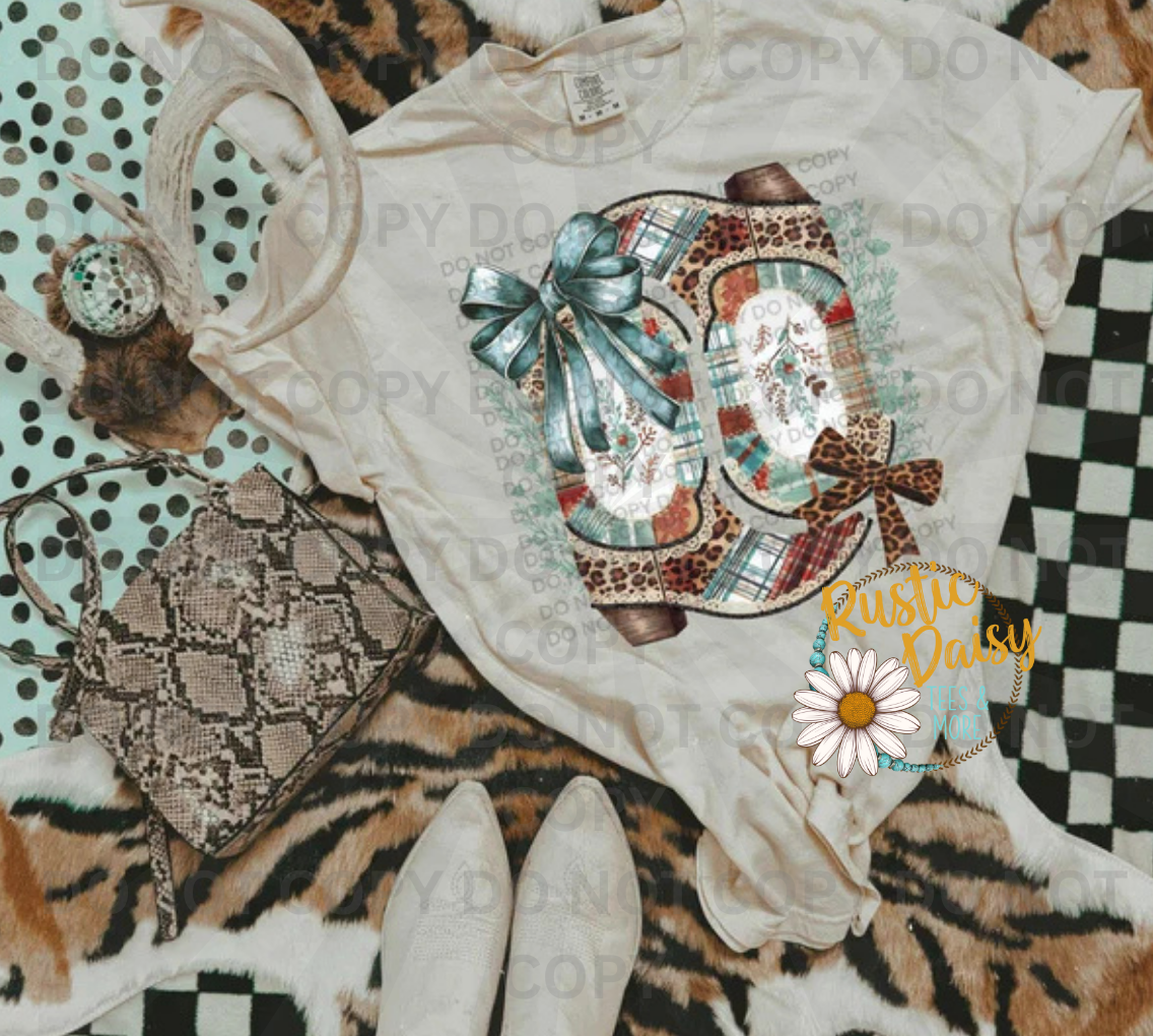 Cowboy boots with turquoise and leopard print patterns, bow, and cross accents