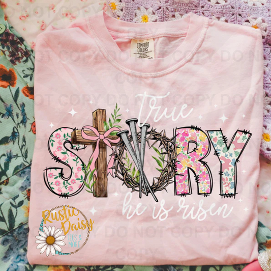 True story he is risen in white & floral text with wooden cross, crown of thorns, pink bow, floral pattern, and stars