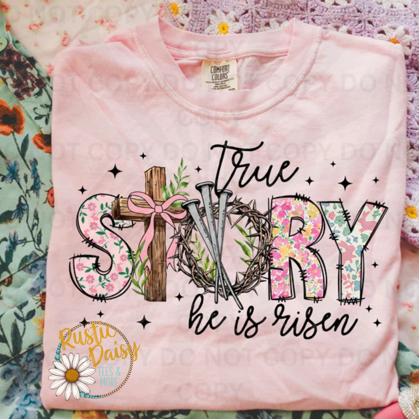 True story he is risen in black & floral text with wooden cross, crown of thorns, pink bow, floral pattern, and stars