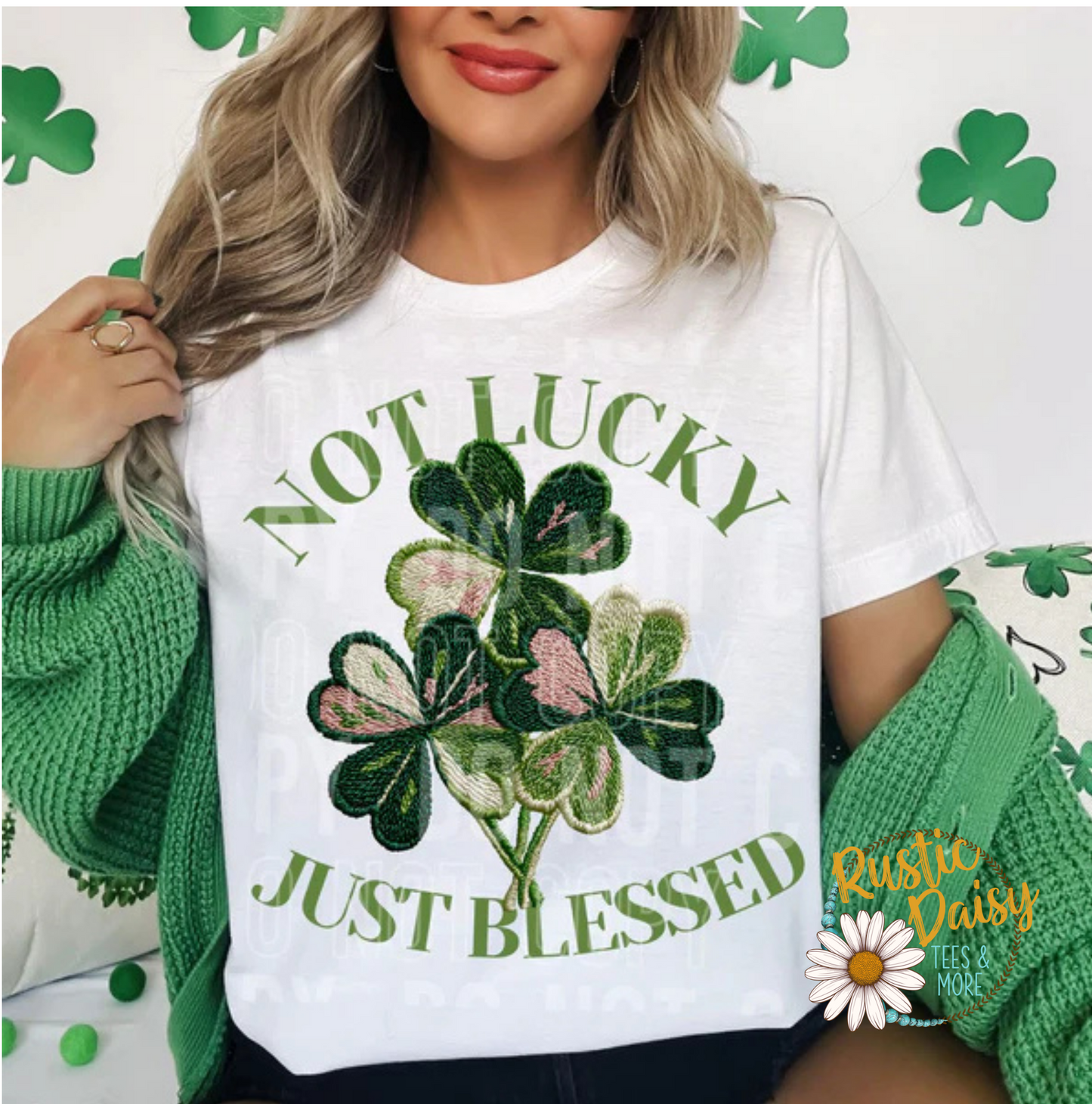 T-shirt with NOT LUCKY JUST BLESSED text with faux yarn shamrocks in green and pink and cream colored patterns"