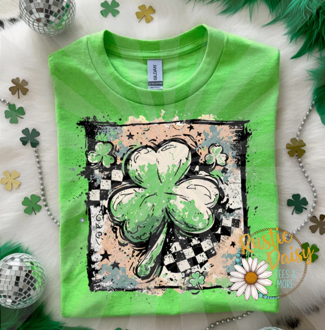 T-shirt with three-leaf clovers in checkered and paint-splashed  patterns