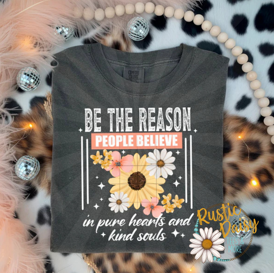 T-shirt with Be The Reason People Believe in pure hearts and kind souls text with sunflower graphics in white