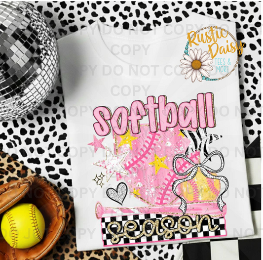 Softball season text with pink softball and bow