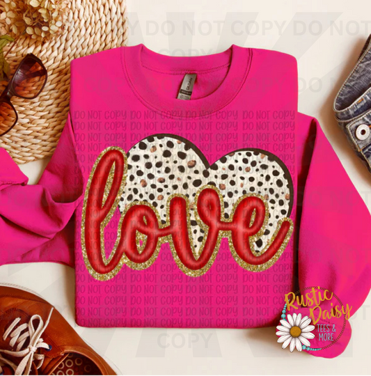Love text in red with gold glitter outline on dalmatian print heart