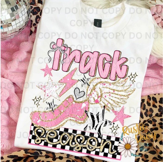 Track season text with pink track shoe and wings