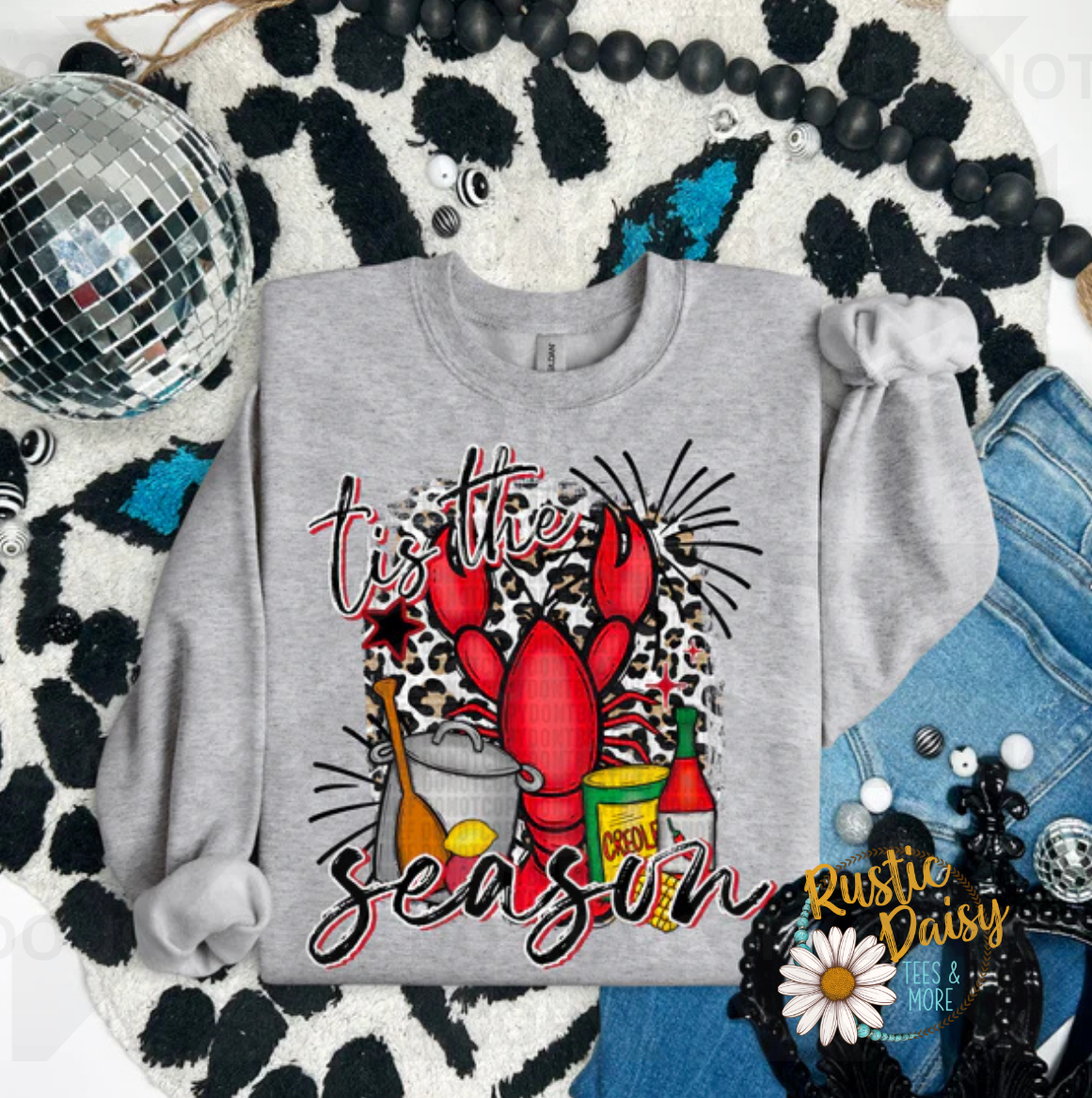 Tis the Season text with red crawfish on leopard print background with crawfish boil pot and seasonings