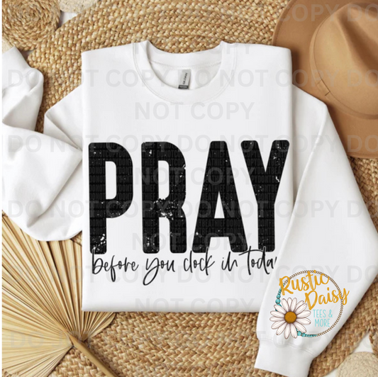 T-shirt with PRAY Before You Clock In Today text in distressed black letters