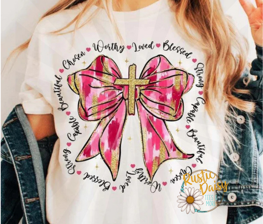 Worthy Loved Blessed text in decorative font with pink and gold brushstroke ribbon bow