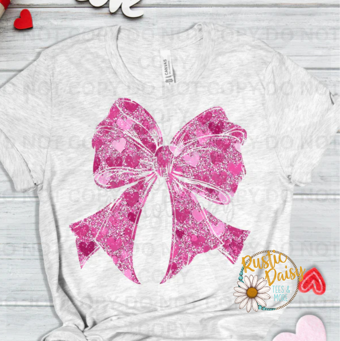Pink heart shapes with decorative faux glitter bow
