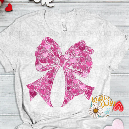 Pink heart shapes with decorative faux glitter bow