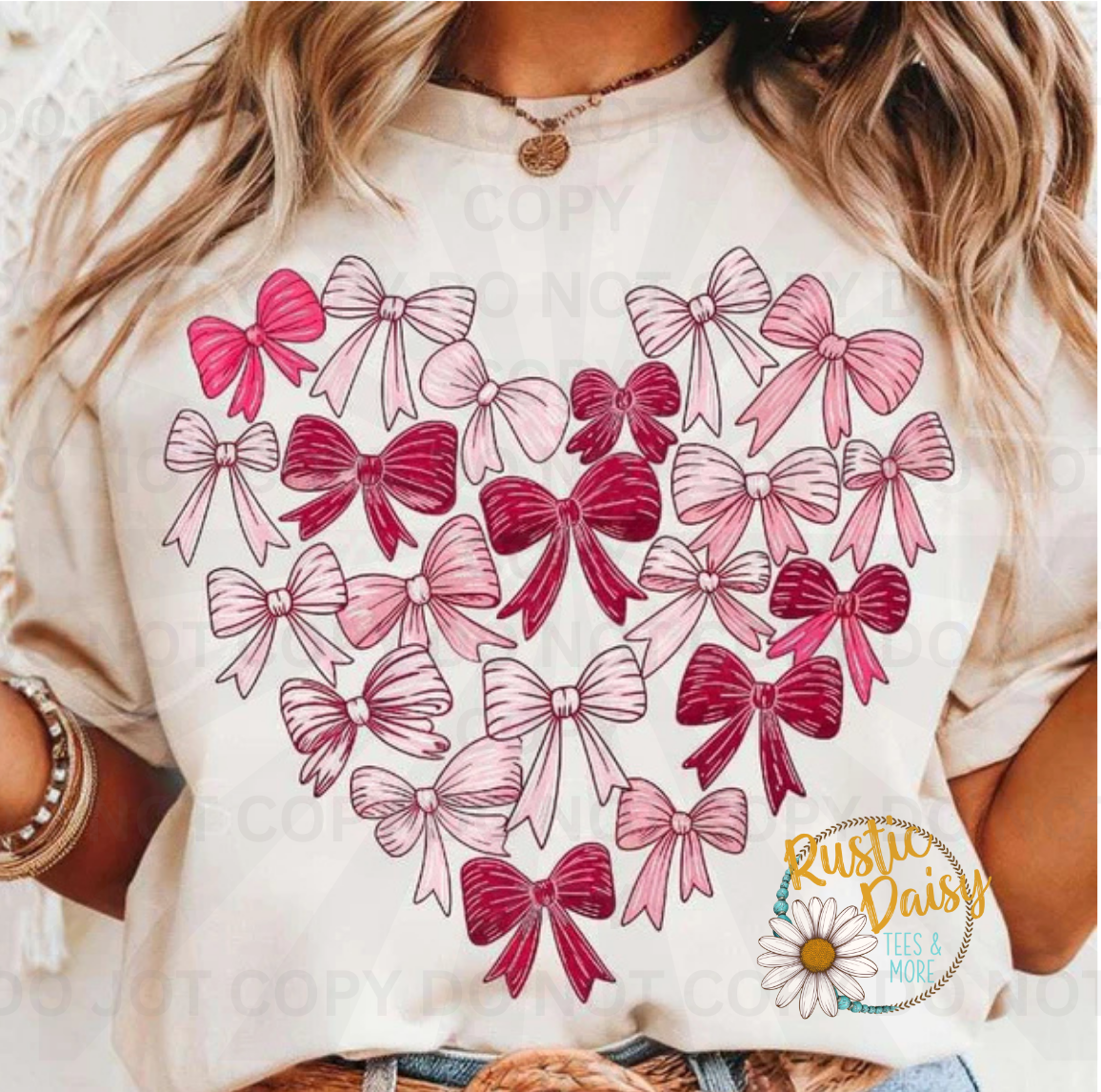 Heart shape made of pink and red ribbon bows in various shades and patterns