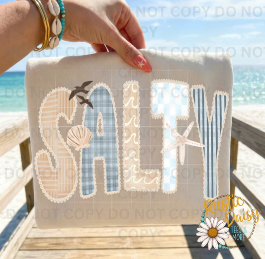 "Salty" in faux patchwork lettering with seashells, starfish, and seagulls.