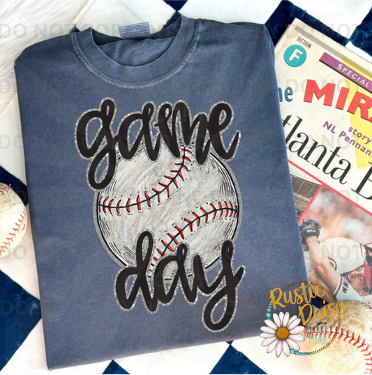 "Game Day" in black script over a distressed baseball.
