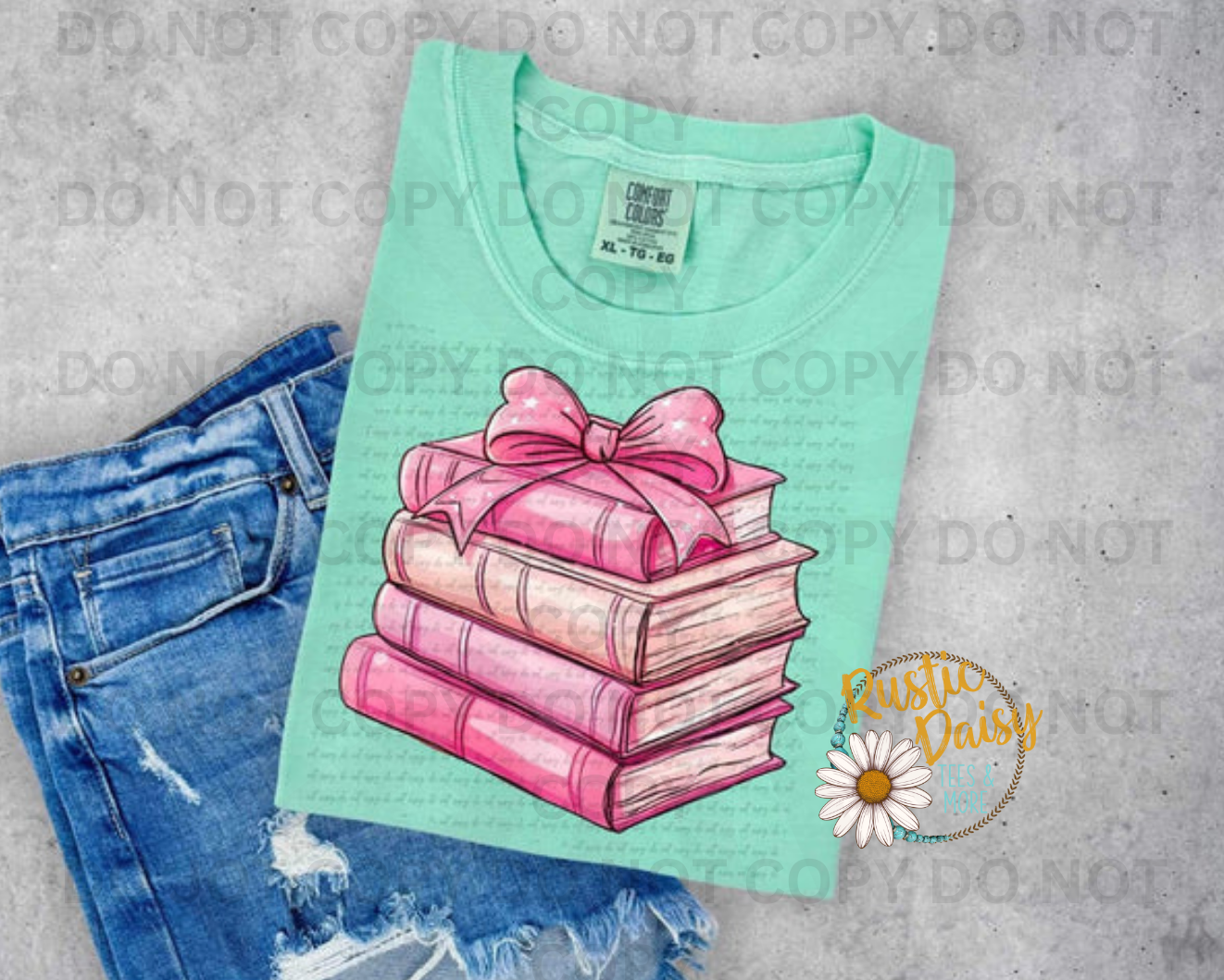 Stack of pink books with decorative pink ribbon bow on top