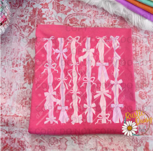 Vertical repeating pattern of pastel pink ribbon bows