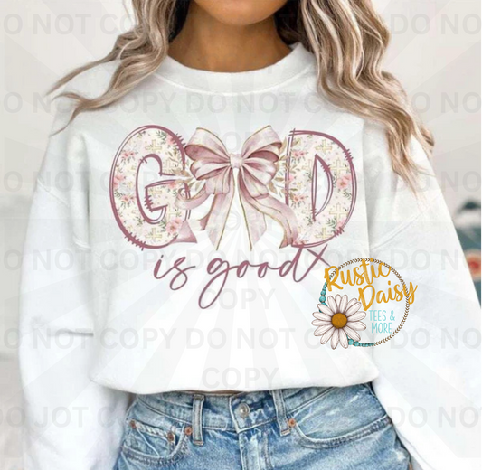 God Is Good text with decorative ribbon bow accent