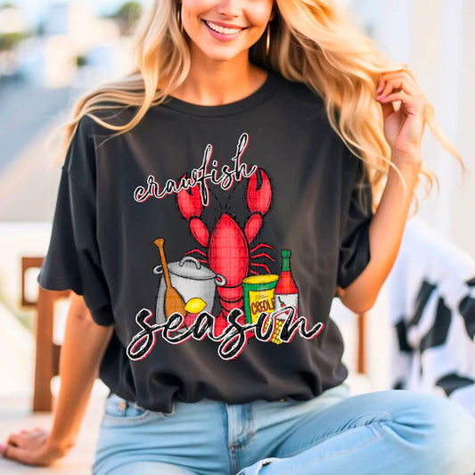 Crawfish Season text with red crawfish and crawfish boil seasonings and pot